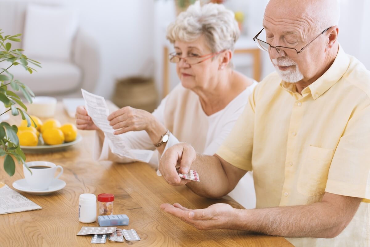 Older adults taking their medication in the summer