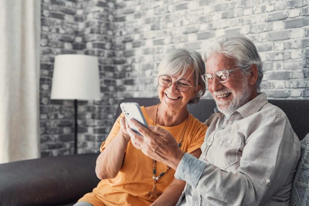 Senior couple looking at their smartphone
