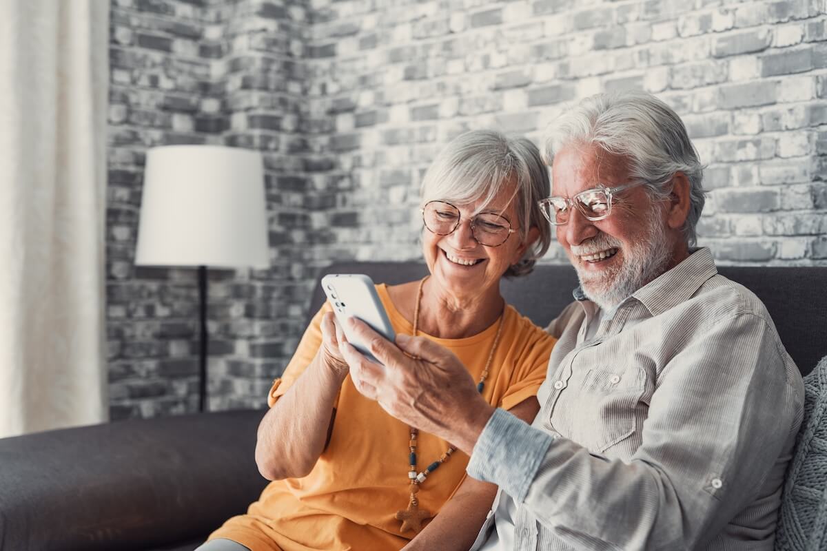 Senior couple looking at their smartphone