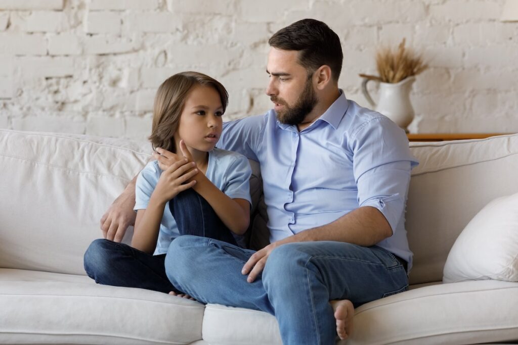 Adult man explaining dementia to his son